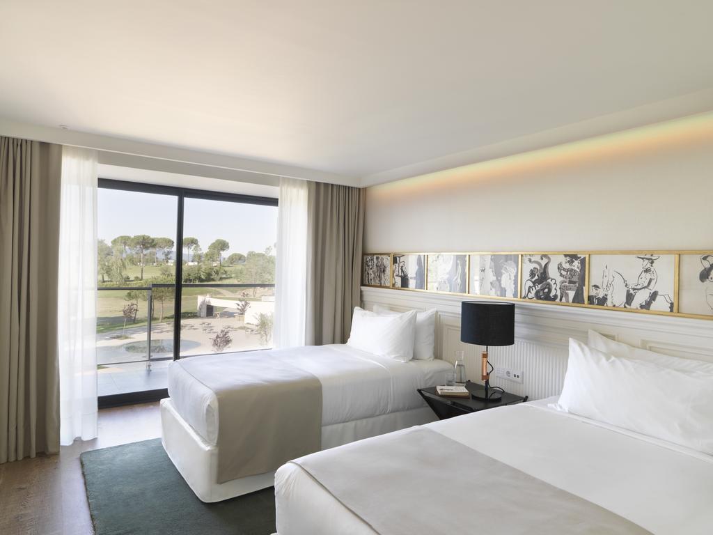 https://golftravelpeople.agiledigitalsolutions.co.uk/wp-content/uploads/2019/04/Hotel-Camiral-at-PGA-Catalunya-Resort-Bedrooms-1.jpg